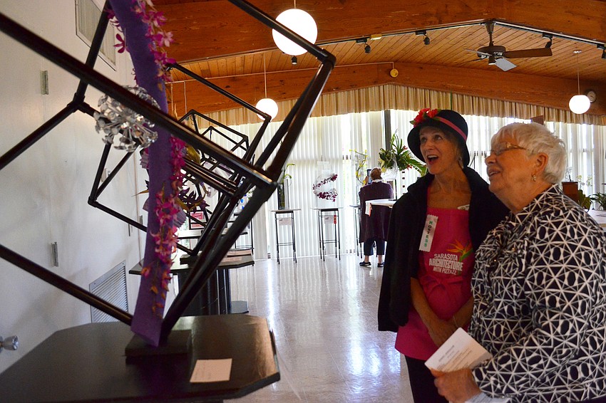 Page Jackson and Esther Swett admire the arrangement by Barbara Rao