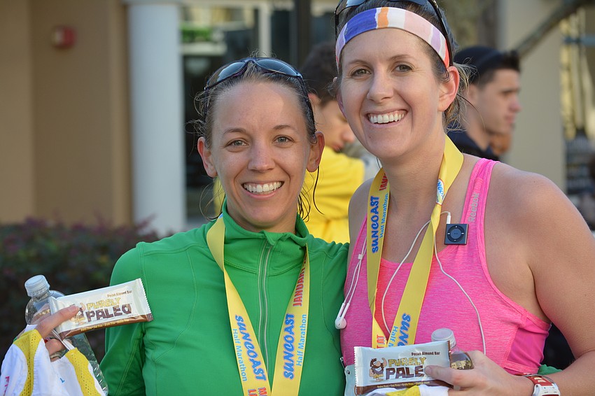 Women's overall champion Corey Talbot, who ran 1:29.42, celebrates with Ashley Messenger, who ran 1:42. Both are from Sarasota.
