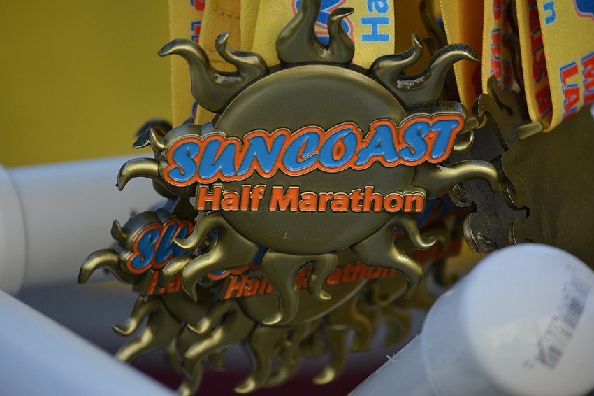 The Suncoast Half Marathon medals hang at the finish line.