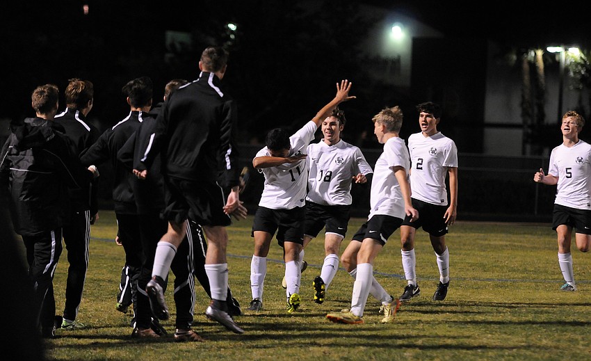 Lakewood Ranch sophomore forward Pablo Vargas dances with his teammates following his second goal of the game.