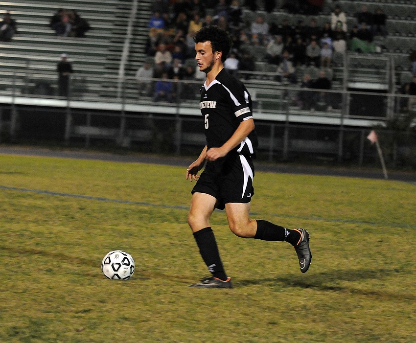 Riverview senior defender Etienne Behan pushes the ball down the field in the second half.