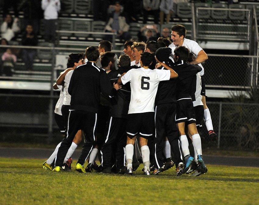 The Lakewood Ranch boys soccer team celebrates following its 3-1 come-from-behind victory versus Riverview in the Class 5A-District 8 championship Jan. 22.
