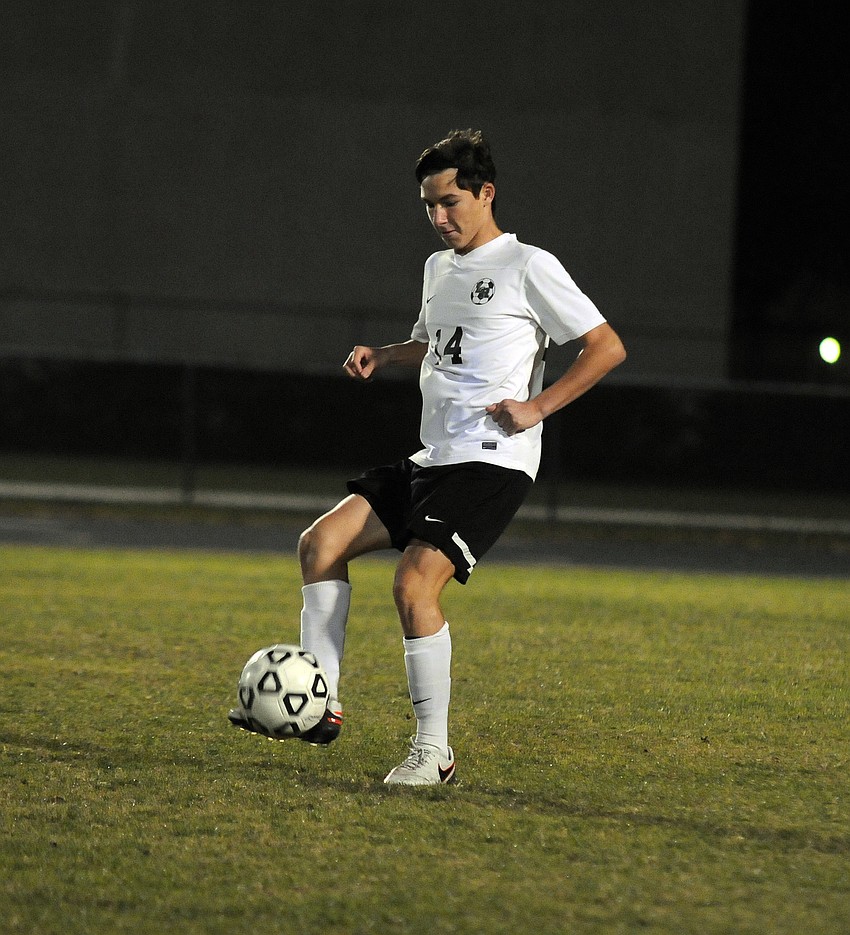 Lakewood Ranch defender Vincent Archibald controls the ball for the Mustangs in the first half.