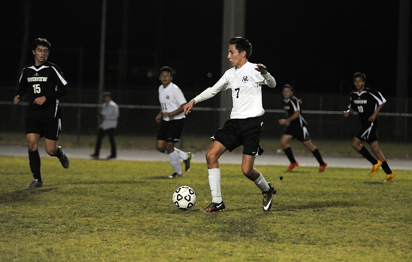 Lakewood Ranch senior midfielder Sebastian Fowler pushes the ball down the field for the Mustangs.