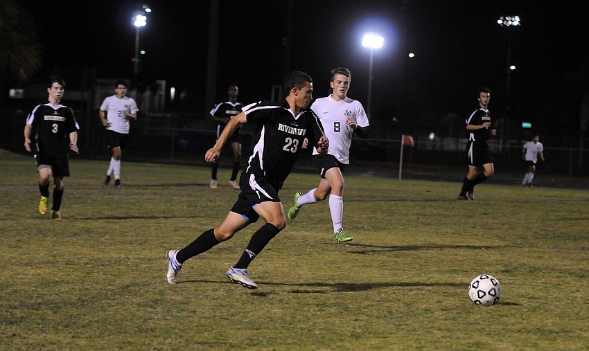 Riverview's Edward Yull pushes the ball up the field for the Rams.