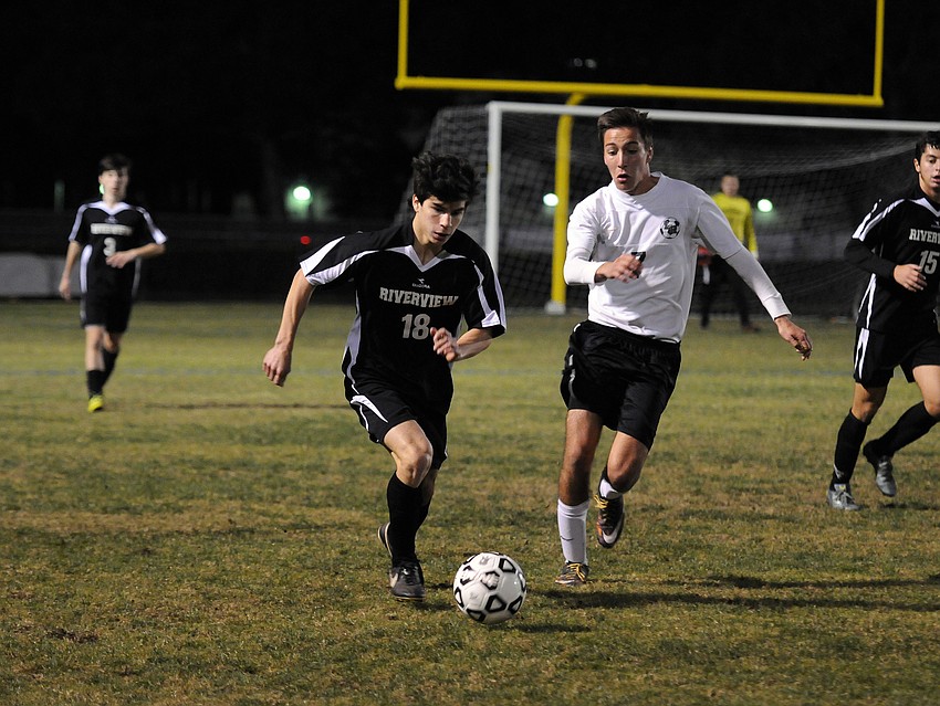 Riverview's Ben Lopez attempts to maneuver the ball past Lakewood Ranch's Sebastian Fowler.