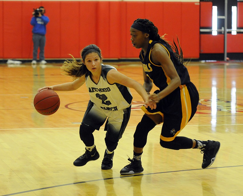 Lakewood Ranch sophomore guard Sarah Fazio attempts to dribble past Winter Haven's Melody Brewington.