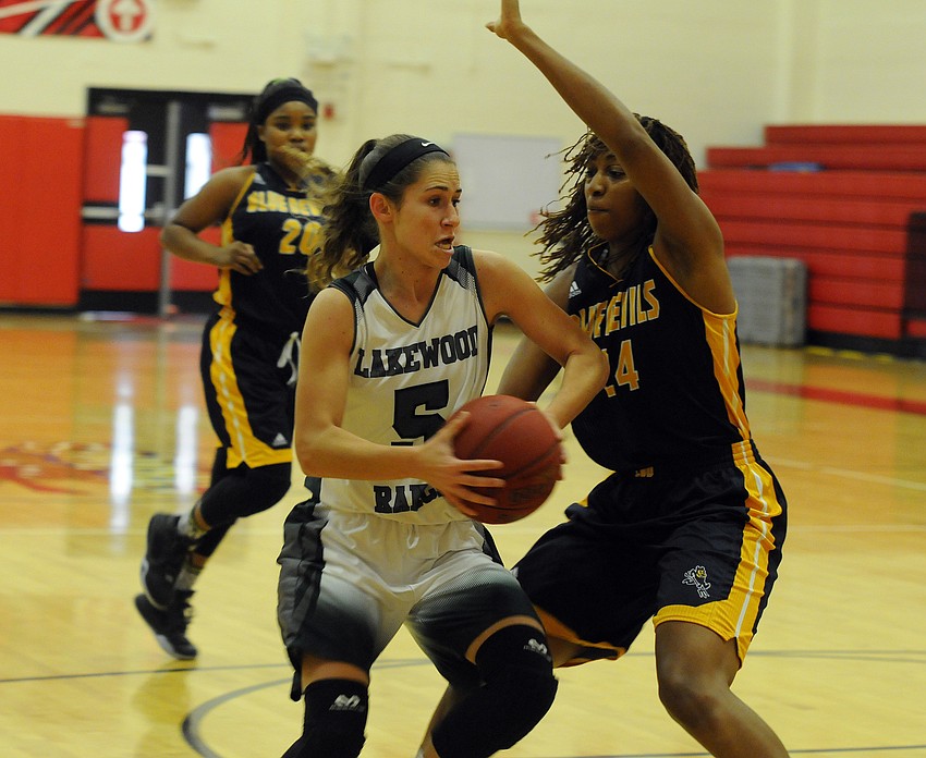 Lakewood Ranch's Kailyn Scully drives to the hoop against Winter Haven's Kiyah Franklin.