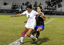 Braden River sophomore forward Lexi Madrid battles Ida Baker midfielder Marcela Montoya for the ball in the first half.