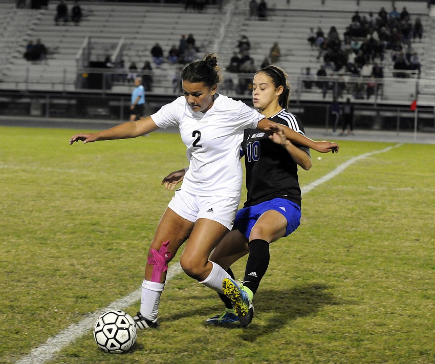 Braden River sophomore forward Lexi Madrid battles Ida Baker midfielder Marcela Montoya for the ball in the first half.