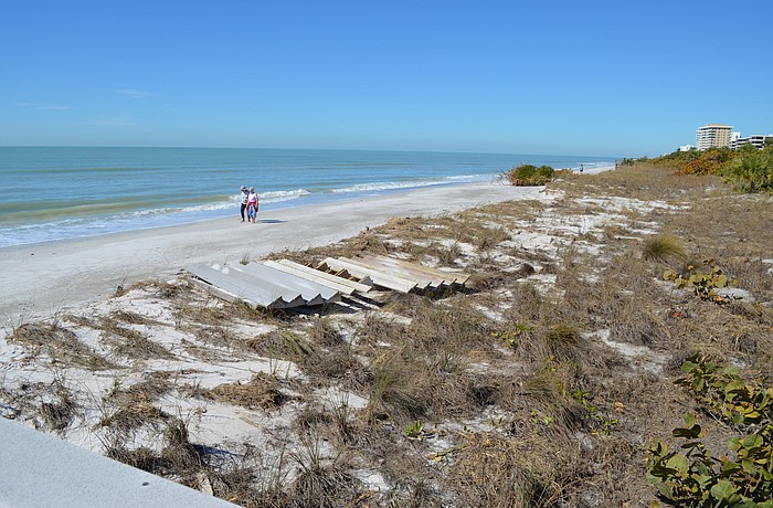 The remaining dunes and vegetation that serves as the last line of shoreline defense for Lâ€™Ambiance and other nearby condominiums, pictured on Monday, after a strong cold front.