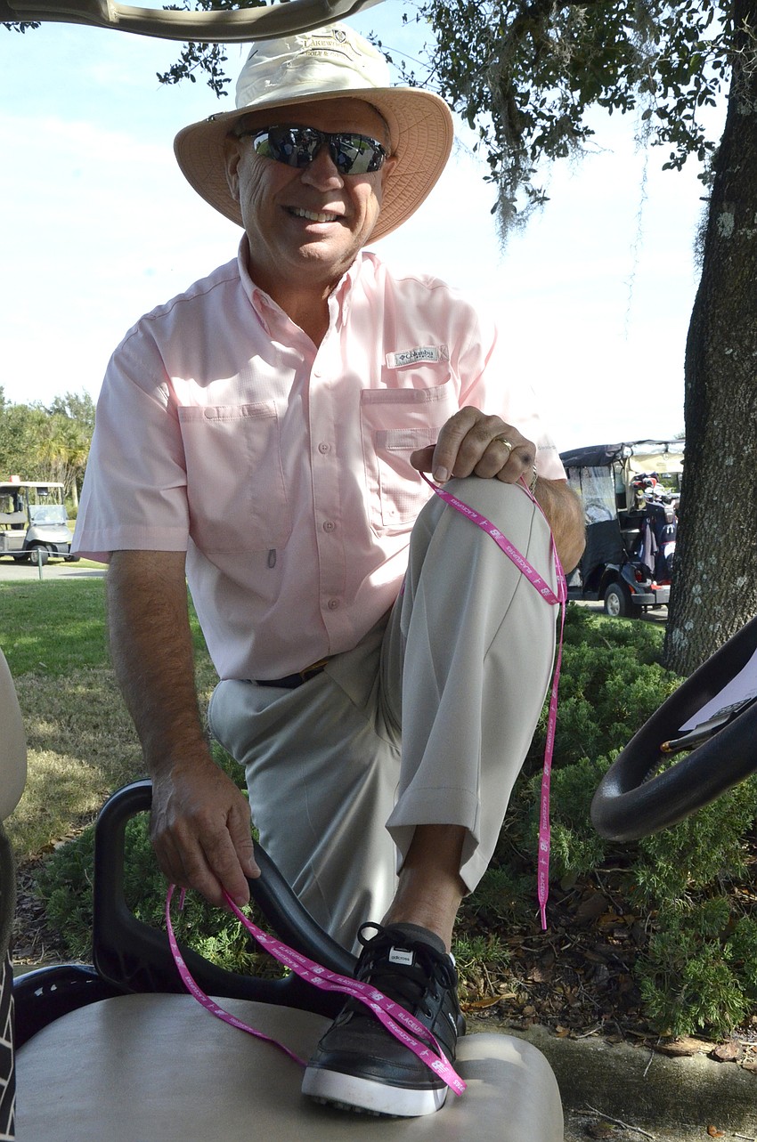 Tim Holt considers a pair of pink shoelaces.