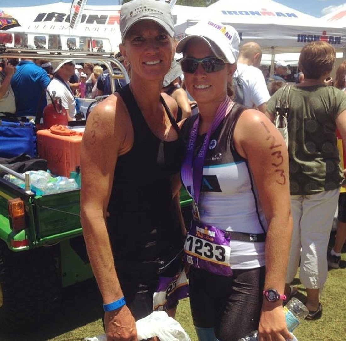 Mother and daughter duo Sharon and Paige Butler after crossing the finish line in 2012 for the Ironman half marathon.