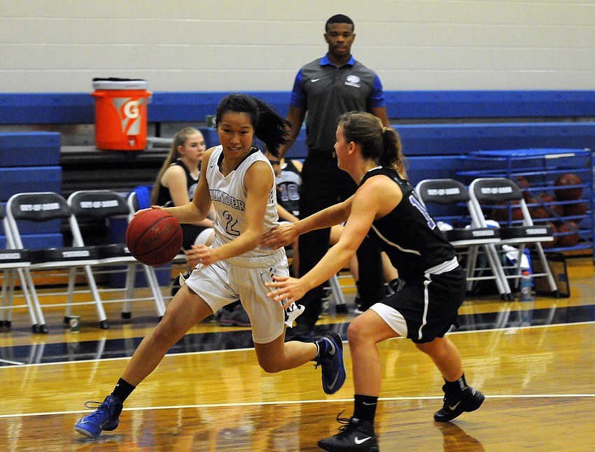 ODA sophomore Liberty Strafuss drives toward the baseline in the first half.