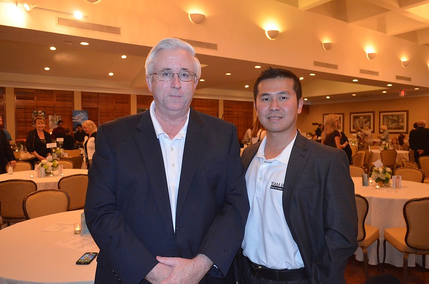 Michael Renick and Eric Teoh, of Garden Club Orchid Sponsor Team Renick