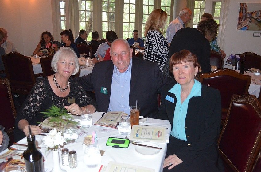 Peg Pluto, of Tommy Bahama, Vince LaPorta and Nancy Taussig, of Barefoot Weddings