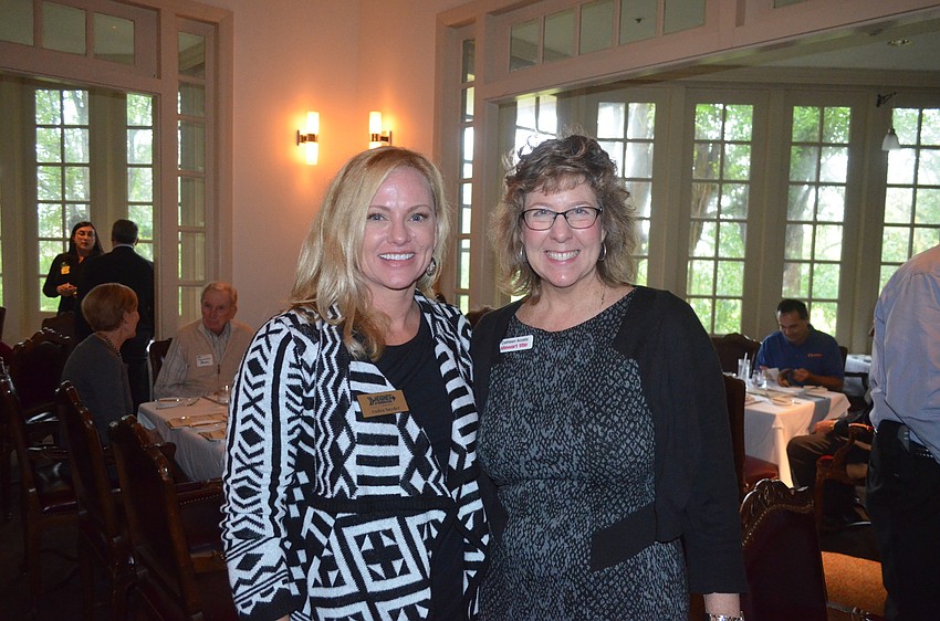 Audra Snyder, of Hughes Exterminators, and Cathleen Acosta, of Stewart Tile