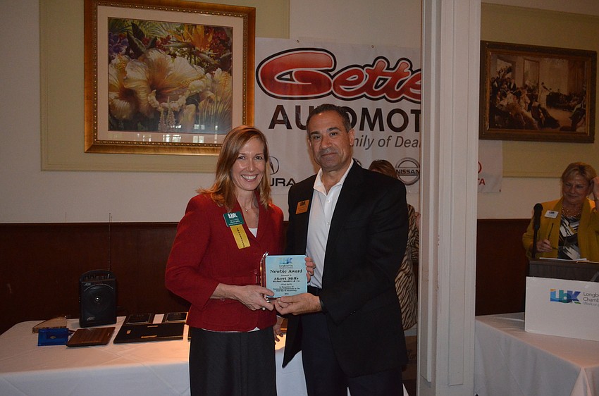 Newbie of the Year Sherri Mills, of Michael Saunders and Co., with 2015 Chairman of the Board Jeff Mayers, of the Resort at Longboat Key Club