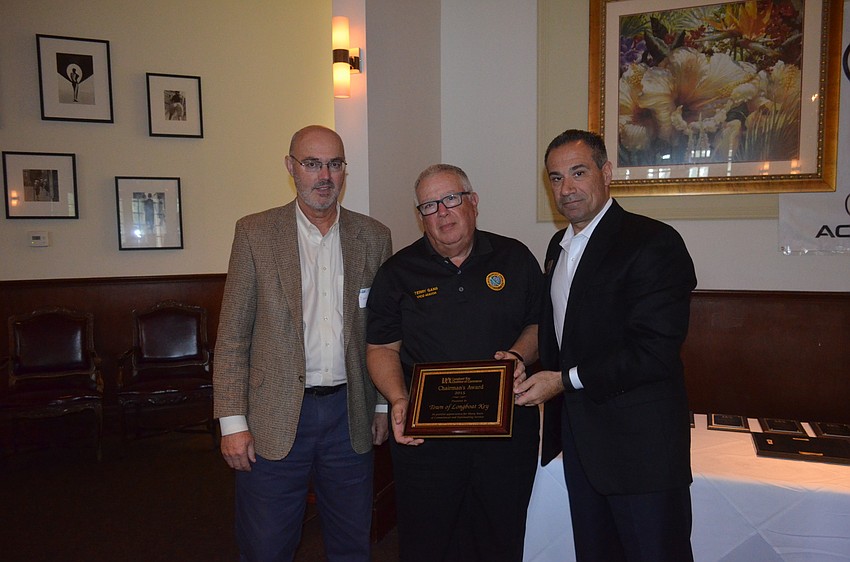 Town Manager Dave Bullock and Vice Mayor Terry Gans, with 2015 Chairman of the Board Jeff Mayers, of the Resort at Longboat Key Club, accept the 2015 Chairman’s Award presented to the Town of Longboat Key