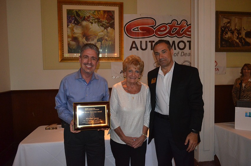 Ed Moran Memorial Award winner Michael Garey, of the Lazy Lobster of Longboat Key, with Marge Moran and 2015 Chairman of the Board Jeff Mayers, of the Resort at Longboat Key Club