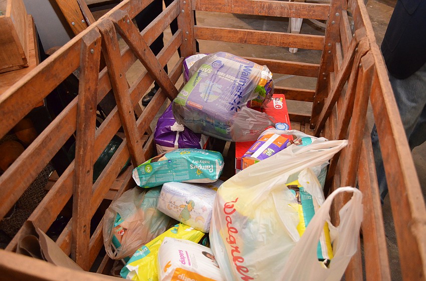 Guests donated diapers at the door for the Healthy Start Coalition of Sarasota County.