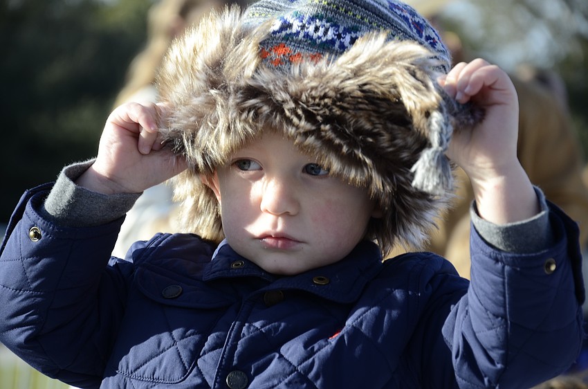 Hudson Rhodes peeks out from his fuzzy bomber.