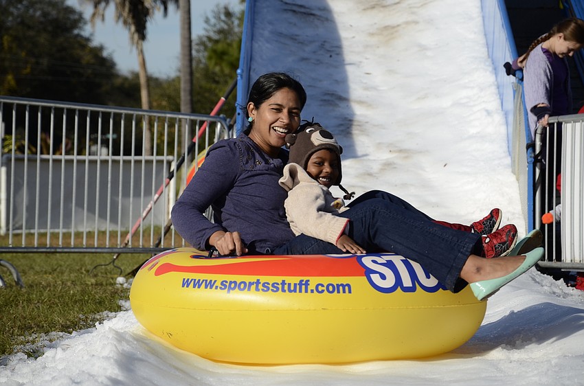 Sirisha Kandepi slides with her son, Rishi Talluru.