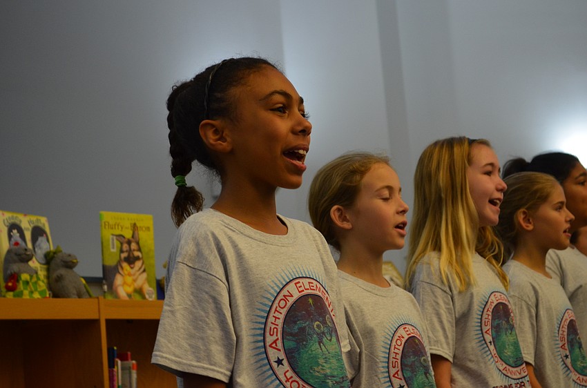 Alyssa Baker sings along with classmates.