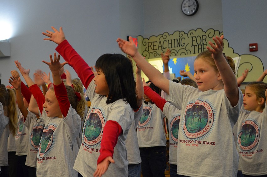 Second-grade students Vivian Setiano and Chloe Haga perform the song 