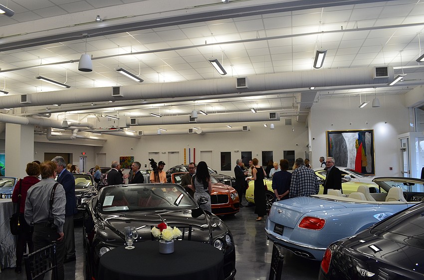 Guests gathered at the Sarasota Studio for the Dimmitt Automotive Group Friday afternoon for the ribbon-cutting.