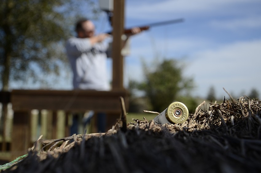 Mark Nickles with Alltrust Insurance aims for a clay pigeon.