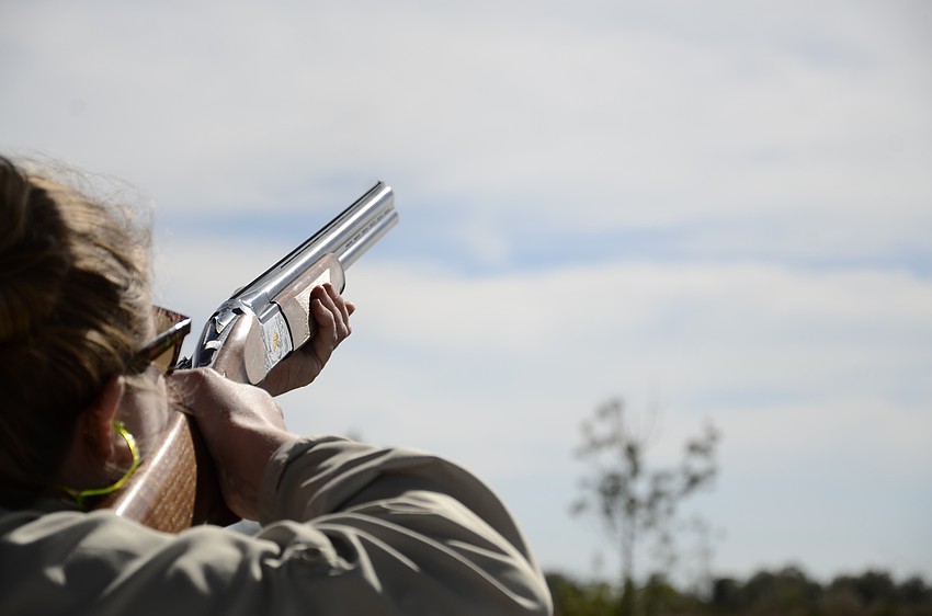 Meagan Miller with Cork's Cigar Bar successfully takes down a target. Miller said she learned how to trap shoot growing up in 4-H.