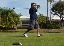 Army Capt. Bobby Withers tees off in the Homes For Our Troops golf tournament on Saturday, Jan. 30 at Rosedale Golf and Country Club. Captain Withers lost his right leg in an anti-personnel mine explosion on his third deployment to Afghanistan.