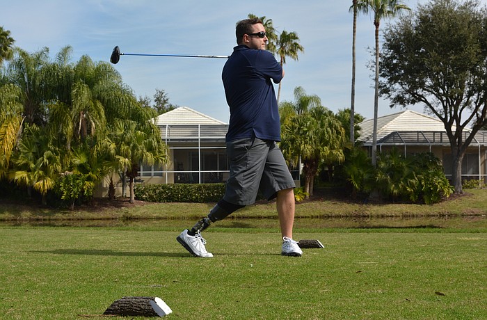 Army Capt. Bobby Withers tees off in the Homes For Our Troops golf tournament on Saturday, Jan. 30 at Rosedale Golf and Country Club. Captain Withers lost his right leg in an anti-personnel mine explosion on his third deployment to Afghanistan.