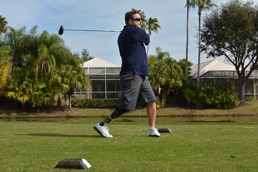 Army Capt. Bobby Withers tees off in the Homes For Our Troops golf tournament on Saturday, Jan. 30 at Rosedale Golf and Country Club. Captain Withers lost his right leg in an anti-personnel mine explosion on his third deployment to Afghanistan.