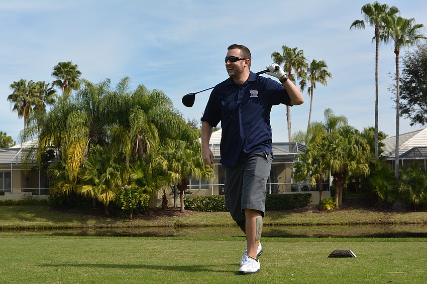 Army Capt. Bobby Withers enjoys the moment after connecting solidly on the first tee.