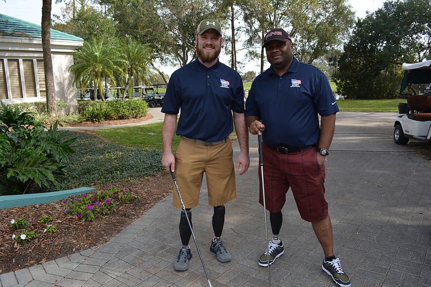 Marine Corp. Josh Langston-White and Army Staff Sgt. Christopher Gordon talk about the Homes For Our Troops benefit before teeing off.