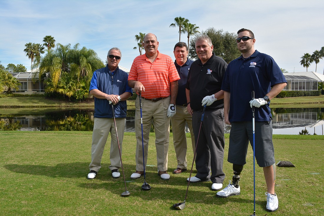 Sarasota's Pat Hogan and Dan Smith, Tim McHale and Chris Mitchell of Homes For Our Troops and Army Capt. Bobby Withers, played in a foursome of the benefit tournament.