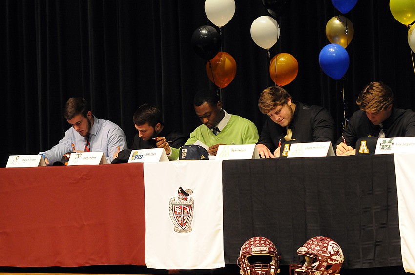 Dylan Tyson, Kyle Thoma, JoJo Louis, Ryan Neuzil and Jacob Huesman were five of nine Braden River football players to sign scholarships Feb. 3.
