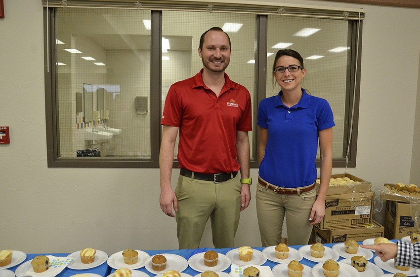 Kevin Hipsher and Christina Marron of First Watch in Lakewood Ranch serve up muffins and coffee.