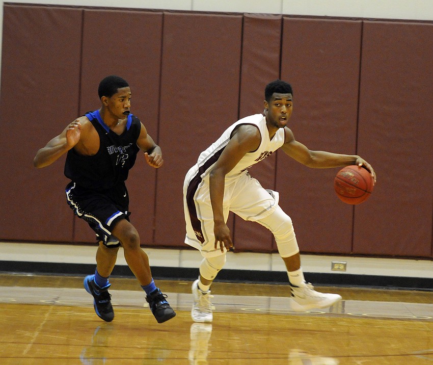 Riverview junior forward Brion Whitley dribbles the ball up the court.