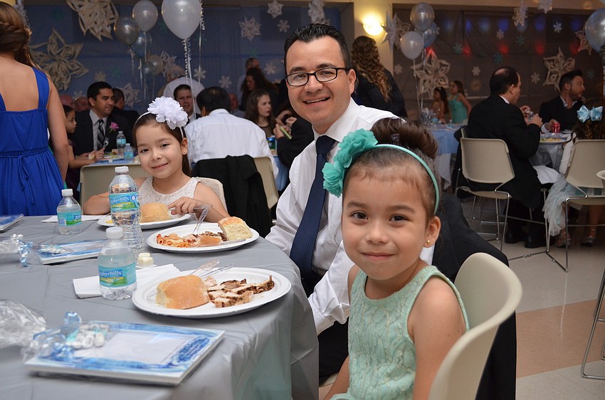 Oscar Martinez with his daughters Ana Maria and Juliana.