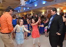 Gwen Precourt and Ilanna Herbert enjoy a dance with their fathers Brian Precourt and Mike Herbert.