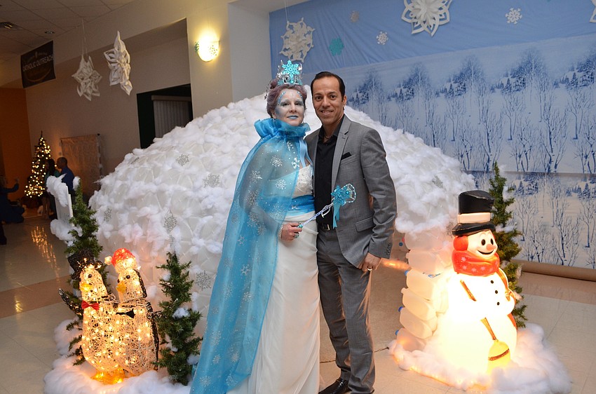 Wendy Santos dressed as an ice queen with her husband Carlos.