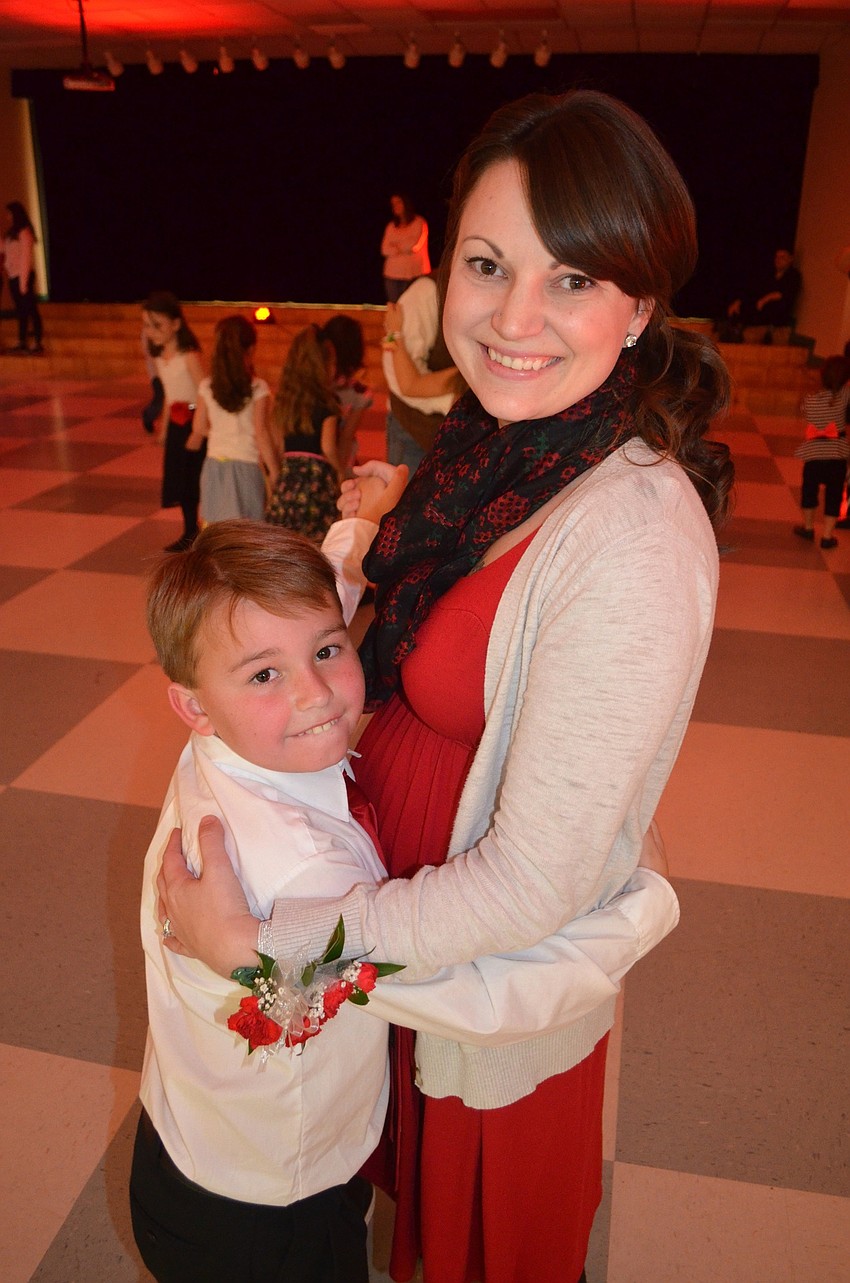 Connor Baker dances with his mother, Kayla.