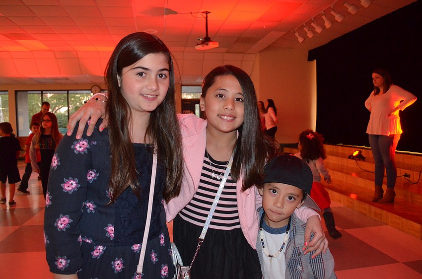 Natalie Rodriguez says cheese with friend, Brianna Ngo, and her brother, Nicholas.