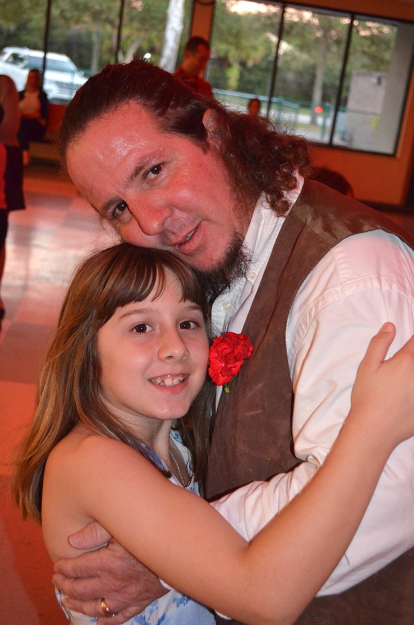 Machael Brown and her father, Howard, enjoy the music.