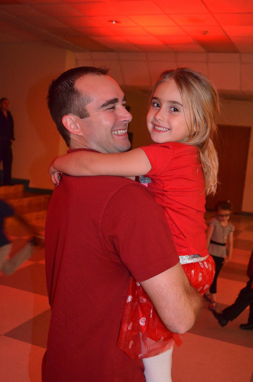 Marco and Quinn Martinetti share laughs on the dance floor.