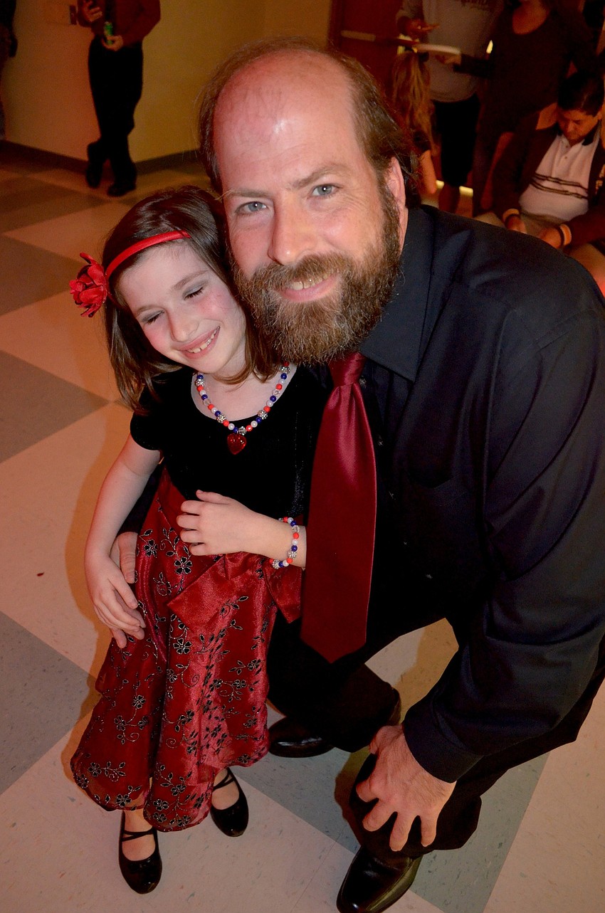 Lindsay and Joel Davis color coordinate their outfits.