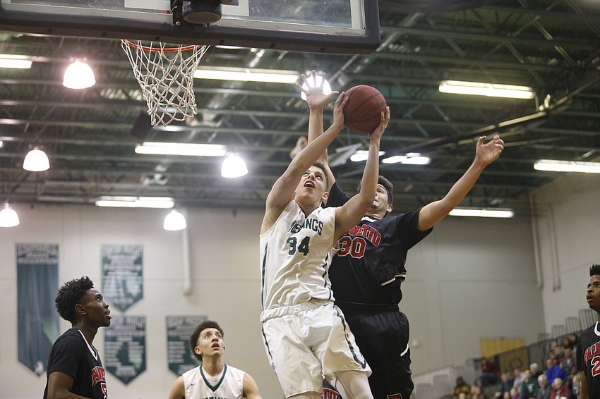 Lakewood Ranch sophomore forward Jack Kelley muscles his way to the hoop in the first quarter. (Photos courtesy Brian Blanco)